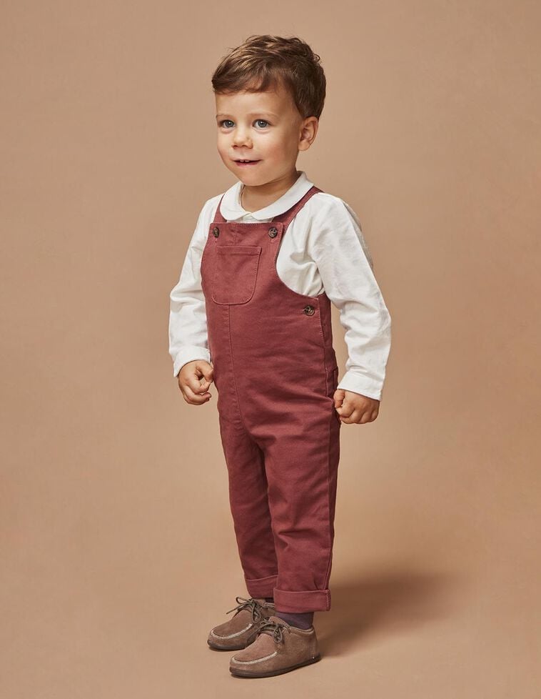 Macacão comprido com bainha vermelha